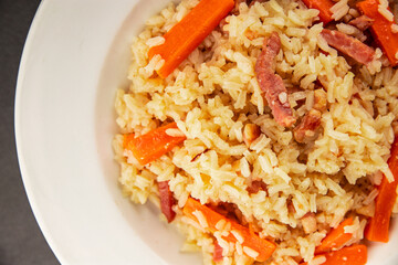Rice meat and vegetables pilaf fresh delicious gourmet food background on the table rustic food top view copy space