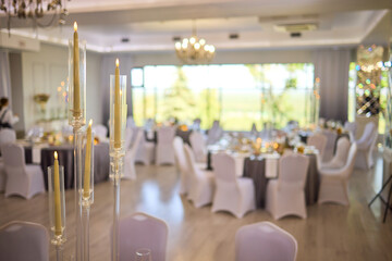 An Elegant Event Venue featuring Candlelit Centerpieces and Exquisitely Refined