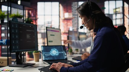 Call center worker arriving at work, using artificial intelligence on laptop to enhance customer...