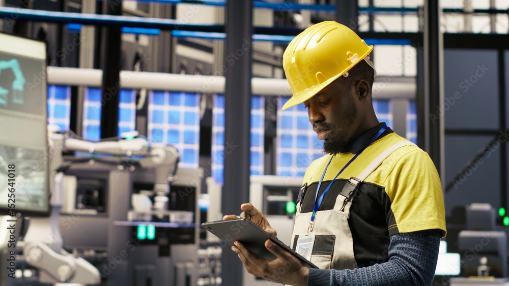 Poster technician in solar panels factory does maintenance using tablet, analyzing iot sensor data. industr