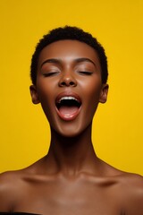 African woman with a joyful expression, mouth open as if singing or speaking loudly.