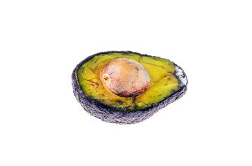 Half spoiled avocado with mold and pit on white background