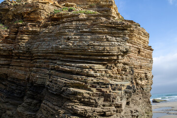 Iconic natural rock formations of Playa de las Catedrales beach in Ribadeo, Lugo, Galicia, Spain,...