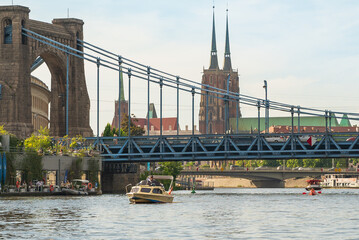 view across the Odra River toward Wroclaw's Grunwaldzki Bridge and Wroclaw Cathedral from the...