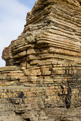 Iconic natural rock formations of Playa de las Catedrales beach in Ribadeo, Lugo, Galicia, Spain, captured during low tide. A breathtaking seascape with caves and arches.