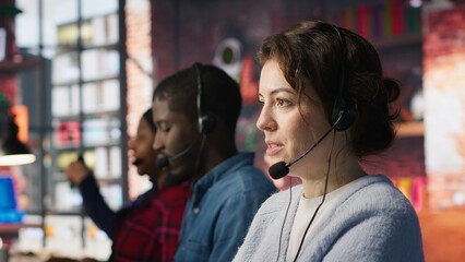 Call center agent handling inbound calls, assisting customers with inquiries, updating account...