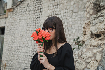 Young Woman Outdoor Smelling The Flowers She Received For Valentines Day 
