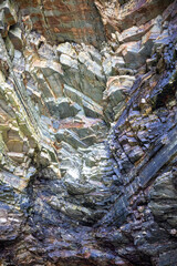 Iconic natural rock formations of Playa de las Catedrales beach in Ribadeo, Lugo, Galicia, Spain, captured during low tide. A breathtaking seascape with caves and arches.