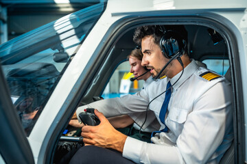 Pilots using flight simulator cockpit for training and education