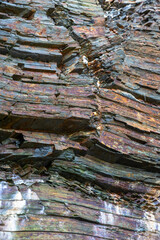 Iconic natural rock formations of Playa de las Catedrales beach in Ribadeo, Lugo, Galicia, Spain, captured during low tide. A breathtaking seascape with caves and arches.