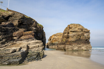 Playa de las Catedrales (Beach of the Cathedrals) reveals extraordinary cliffs and caves shaped by the sea, Ribadeo, Spain, perfect for nature and landscape lovers, empty and peaceful.