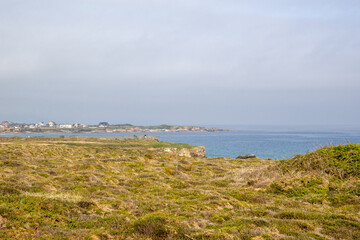 Beautiful cliffs of Playa de las Catedrales viewed from a wooden boardwalk in Ribadeo, Galicia. Nature and coastal beauty combined.