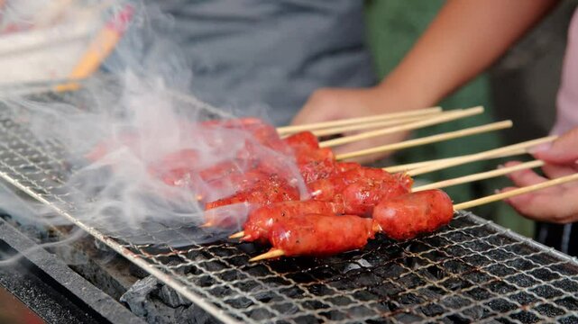 Close-Up of Filipino Longganisa Sausages Grilling on Skewers