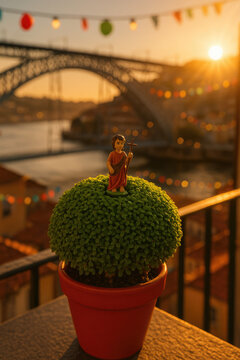 Symbol of S&atilde;o Jo&atilde;o: Manjerico Framed by the Dom Lu&iacute;s I Bridge at Dusk, Overlooking the Douro River During Porto&rsquo;s Beloved Festivities.

