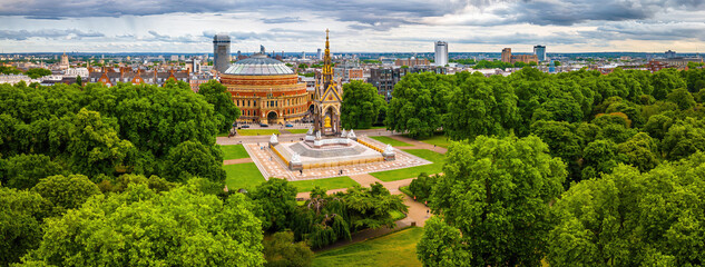 Aerial view of the Royal Albert Hall in London, surrounded by classic red-brick buildings, roads, and green trees