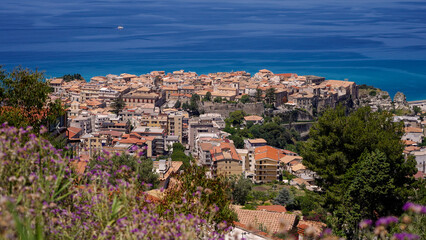 Fototapeta premium Panoramic view of Tropea, a charming town perched on a cliff overlooking the Tyrrhenian Sea in Calabria, Southern Italy, during a sunny summer day
