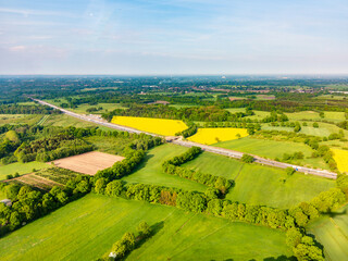 Obraz premium aerial of rural landscape with river near Hamburg with highway