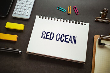 There is notebook with the word Red Ocean. It is as an eye-catching image.