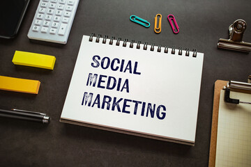 There is notebook with the word Social Media Marketing. It is as an eye-catching image.