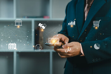 Businessman using a smartphone for control business management and network technology.  Network structure and business icons. Business people is working.