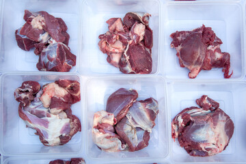 some qurban meat in transparent plastic containers