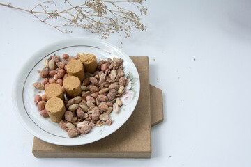 Paçoca , Peanuts and Peanuts Praliné on a white background. Close-up.