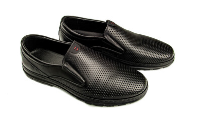 Black leather shoes are presented on a white background, the execution of which is distinguished by the high-quality elaboration of all the details of the product,