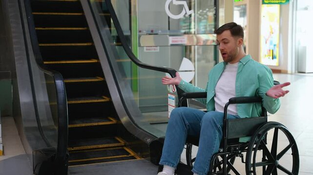 Person with disability man expressing frustration at inaccessible escalator