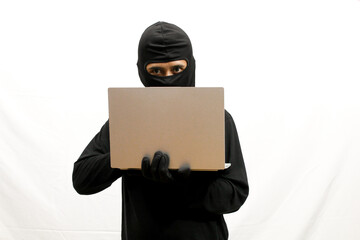 Hackers wearing black masks are looking for loopholes to penetrate system security using stolen...
