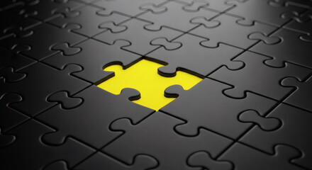 Fototapeta premium A close up of a black puzzle with a missing piece revealing a bright yellow background underneath it
