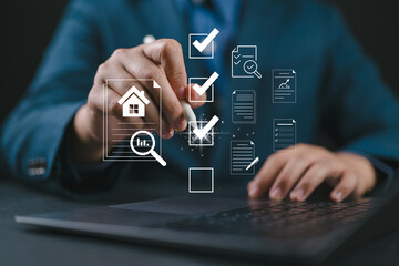 Man signing real estate documents on laptop. Symbolizes property management and investment...