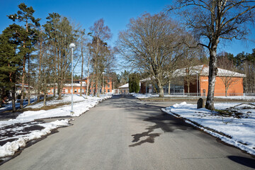 Linneskolan school road and campus buildings with snow on a sunny winter day in Haessleholm, Sweden