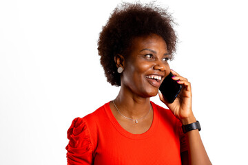Young black woman, looking away, has friendly phone call, on a white background