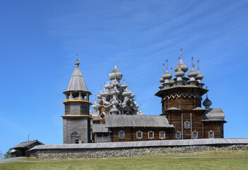 Medieval wooden bell tower and Church of the Transfiguration of the Lord built in 1714 on Kizhi Island on Onega Lake in Karelia