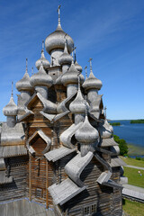 Numerous domes and crosses of medieval wooden Church of the Transfiguration of the Lord built in 1714 on Kizhi Island on Onega Lake in Karelia