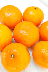 Close-Up of Seven Bright Orange Fruits