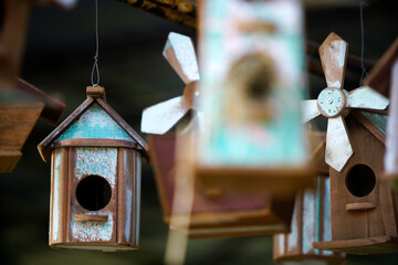 Colorful Birdhouses Hanging in a Natural Outdoor Setting