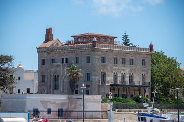 Boat trip to Favignana island, walking in old town in sunny day, Egadi islands near Sicily, Italy