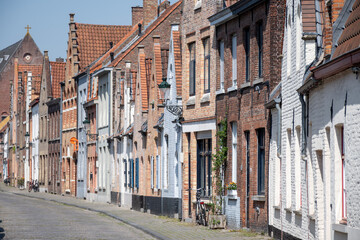 Old medieval houses in narrow streets in central Bruges, Flanders, Belgium, tourists destination in Europe