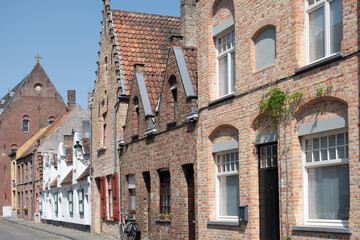Old medieval houses in narrow streets in central Bruges, Flanders, Belgium, tourists destination in Europe