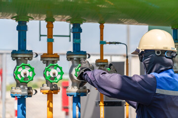 The technician opening valve closure.