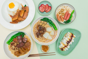 An aerial shot of Hong Kong's local street food, featuring cart noodles, rice rolls, rice noodles, and classic budget-friendly dishes.