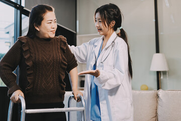 Young doctor examines senior patient's leg.