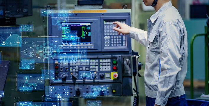 Digital technology concept with worker operating control panel in factory