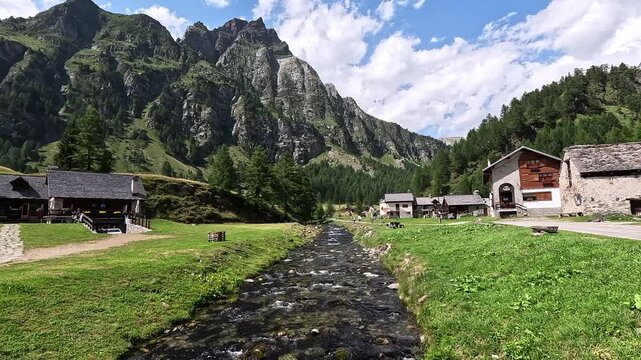 Crampiolo, a scenic alpine hamlet in Alpe Devero Natural Park, Piedmont, Italy, surrounded by rugged mountains and lush meadows.