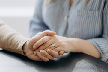 Man and woman holding each other hands