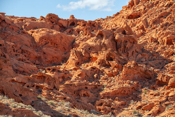 Valley of Fire State Park, beehive formations. Reddish-brown sandstone  displays natural erosion, forming grooves and small caves. 