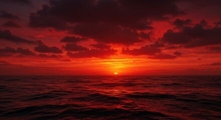 Obraz premium power of nature with this intense red sunset over dark ocean waves. Dramatic and cinematic, the fiery sky reflects on the water's surface. Perfect for themes of passion, climate cha