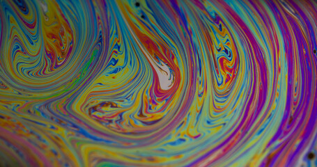 Naklejka na ściany i meble Dye blend. Water fuel fluid. Defocused yellow green purple color ink flowing blue stains leak on abstract creative acrylic background.