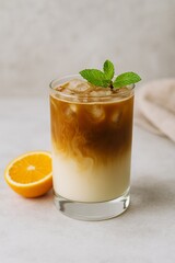 Iced Coffee with Orange and Mint Garnish